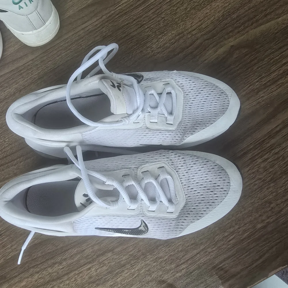 White Nike Sneakers with Black Swoosh
